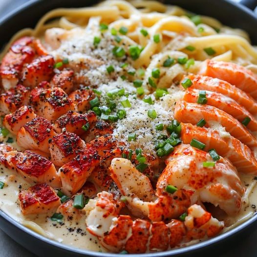 CAJUN LOBSTER, CRAB, AND SALMON ALFREDO